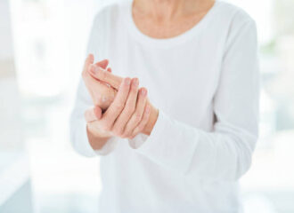 woman applying CBD relief rub cream in a bathroom at home