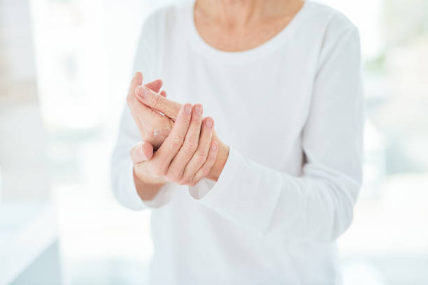 woman applying CBD relief rub cream in a bathroom at home